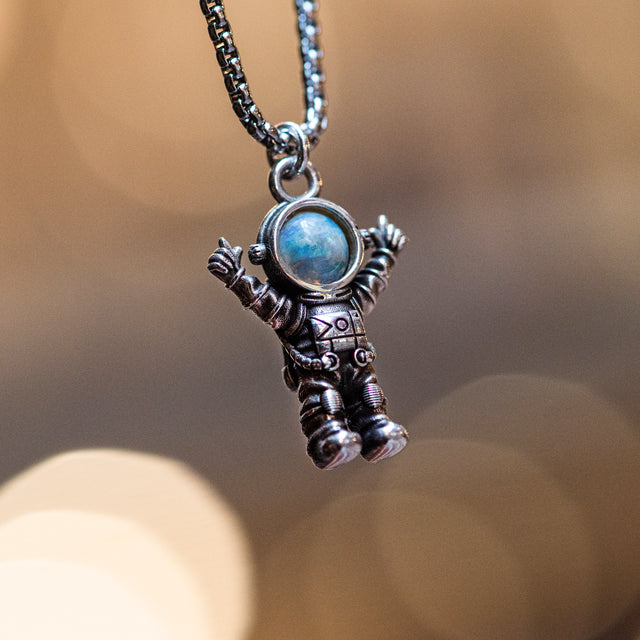 Silver astronaut pendant